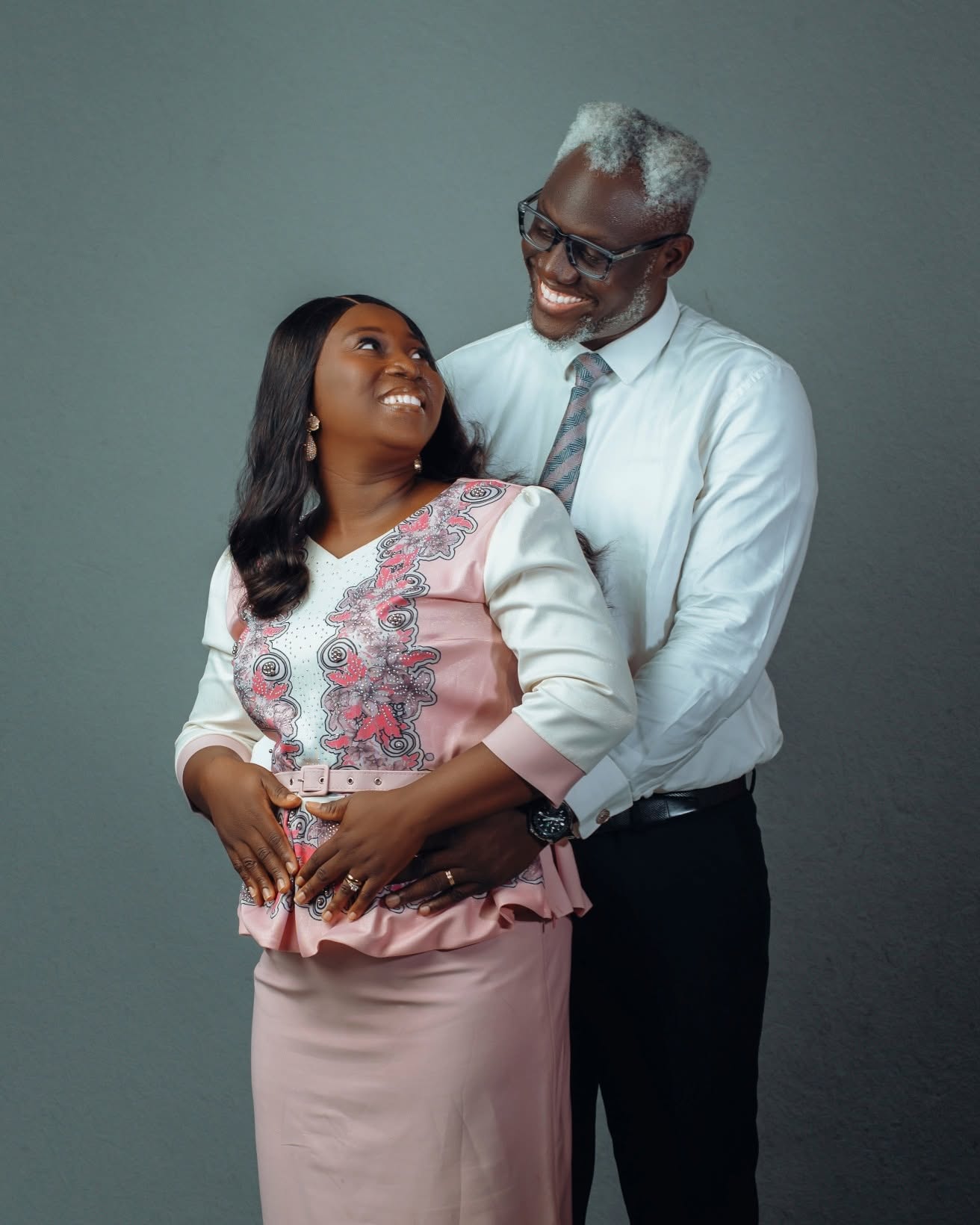 Evangelist Kesiena Esiri and his wife in a warm portrait